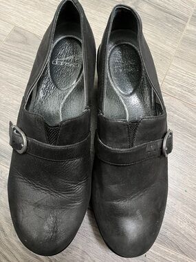 Dansko Black Leather Slip-On Loafers with Buckle Accent